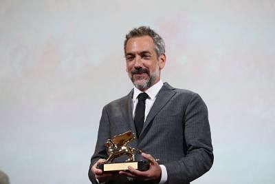 VENICE, Sept. 7, 2019 (Xinhua) -- American director Todd Phillips reacts after his film "Joker" winning the Golden Lion for best film at the 76th Venice Film Festival in Venice, Italy, on Sept. 7, 2019. The film "Joker" by American director Todd Phillips won the Golden Lion at the 76th Venice Film Festival on Saturday. (Xinhua/Cheng Tingting/IANS)