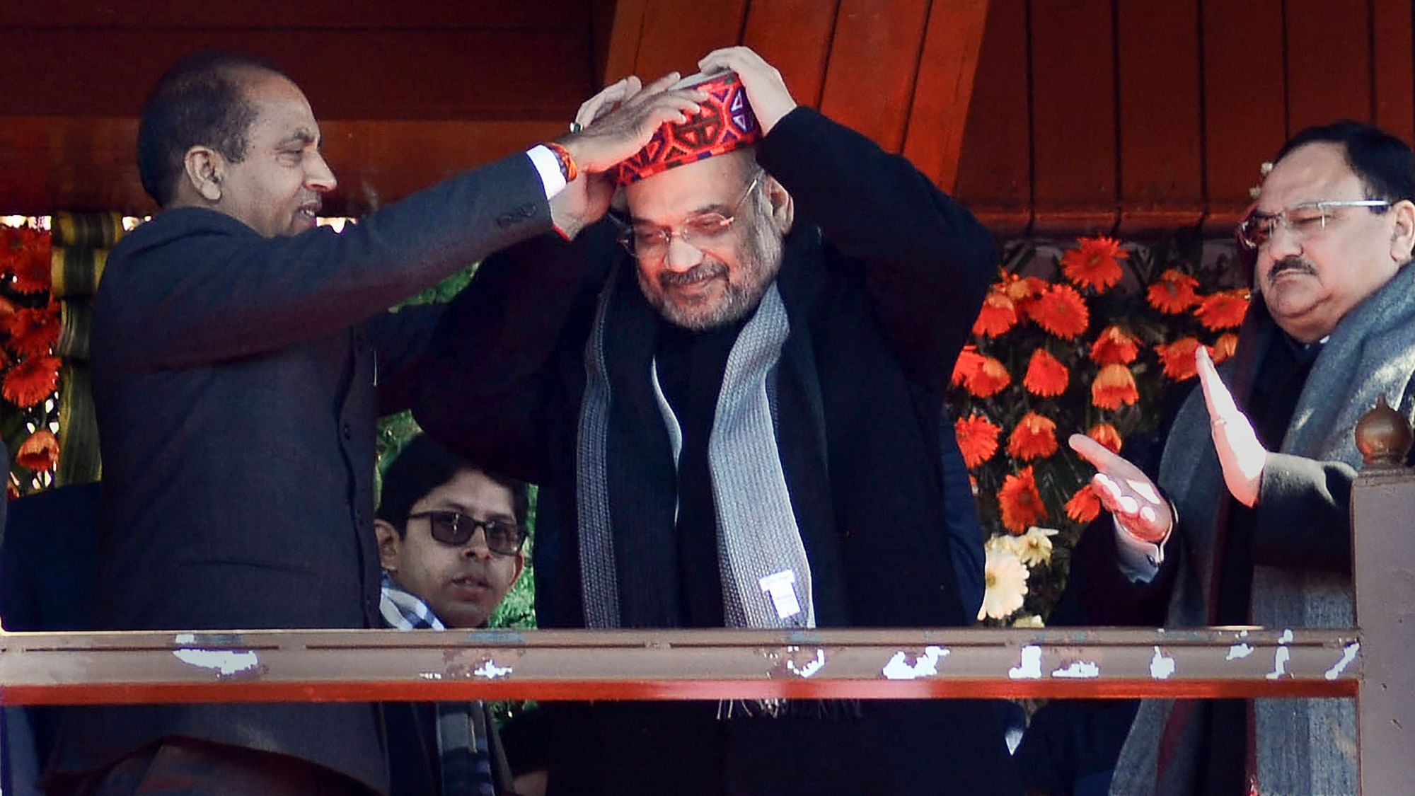 Union Home Minister Amit Shah being presented a traditional Himachali cap by Chief Minister Jai Ram Thakur  at Ridge in Shimla.