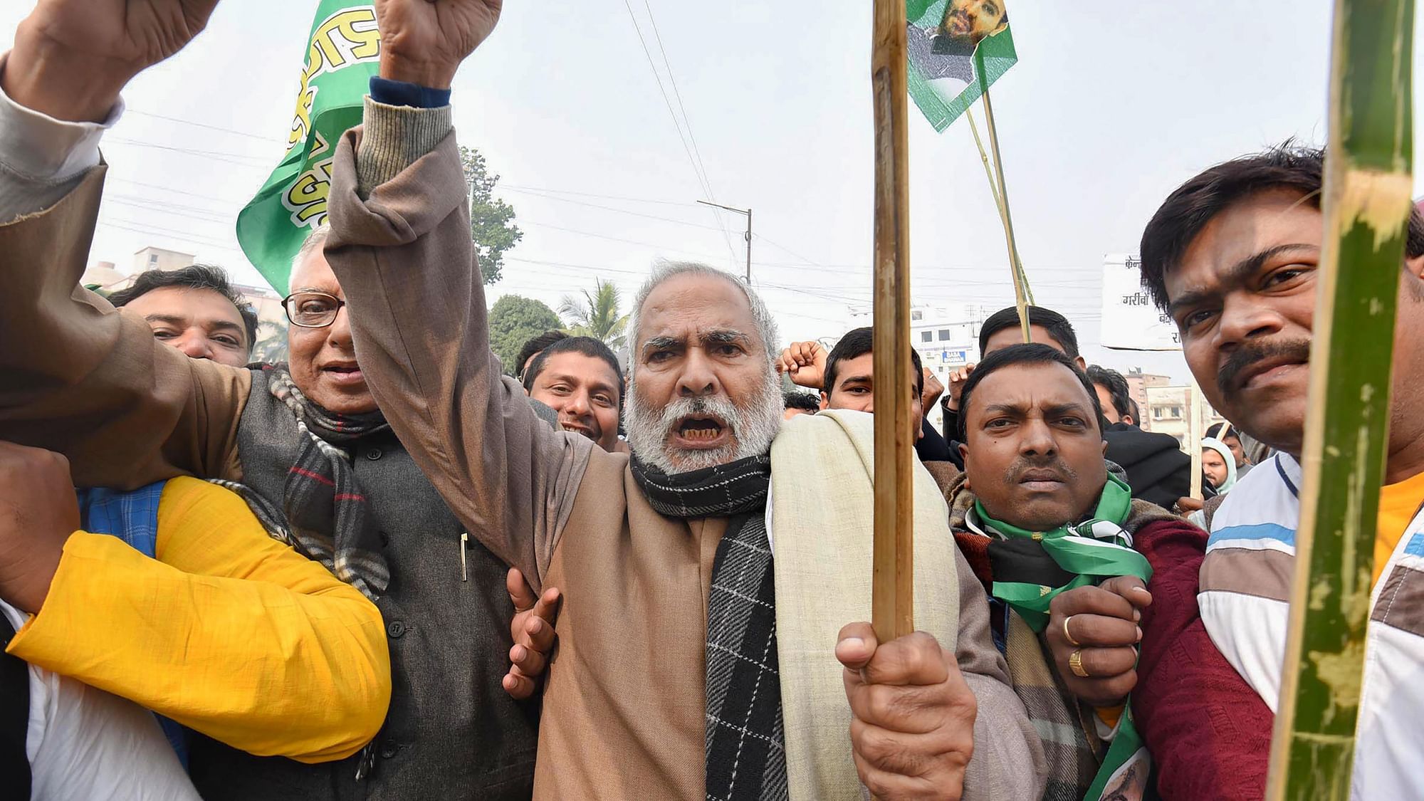 RJD Vice President Raghuvansh Prasad with supporters raises slogans during a demonstration against NRC and Citizenship (Amendment) Act (CAA) during Bihar Bandh, in Patna.