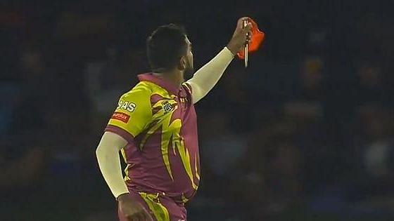 Shamsi took out a red handkerchief from his pocket before turning it into a stick to celebrate his wicket.