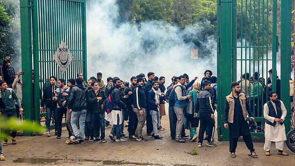 Students of Jamia Millia Islamia University clash with the police during a protest against the Citizenship Amendment Bill (CAA), at the University in New Delhi.