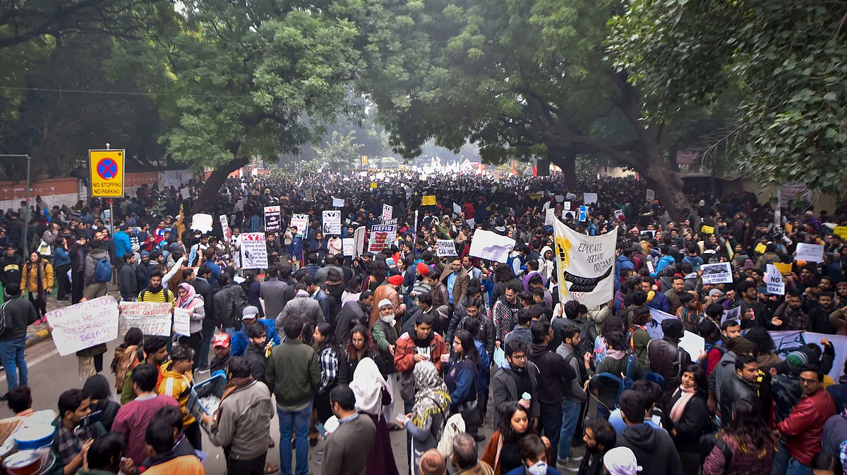 Protesters hold placards as they raise slogans during a demonstration against the Citizenship (Amendment) Act at Mandi House on 19 December.