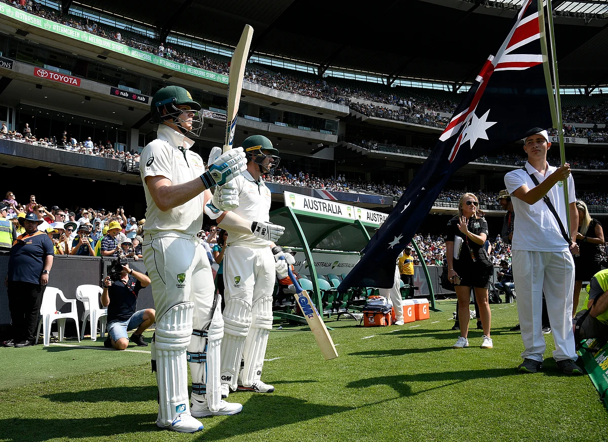 Australia’s Steven Smith, left and Travis Head, right prepare to enter the field during play in their cricket test match against New Zealand in Melbourne, Australia, Friday, Dec. 27, 2019.
