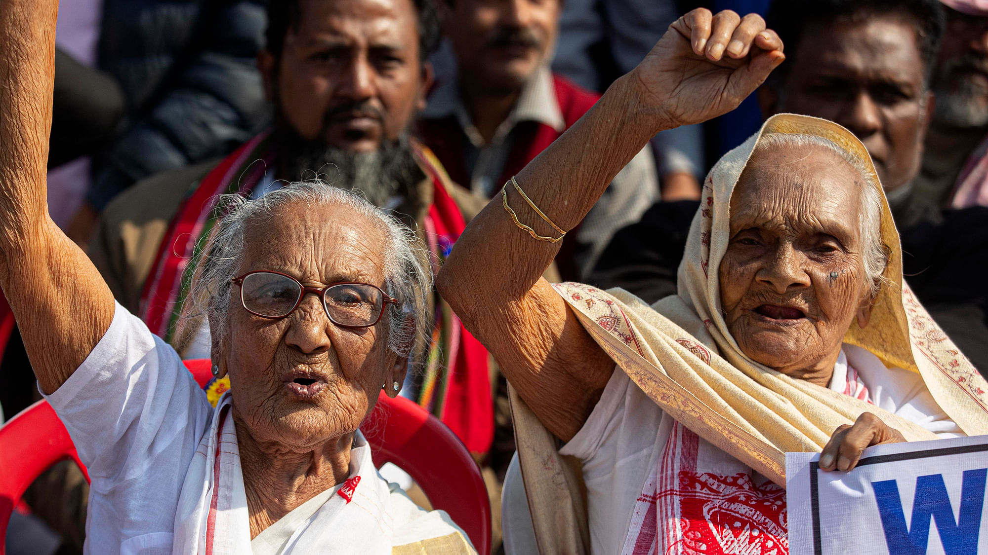 Elderly women shout slogans during a protest rally against the Citizenship  Act in Guwahati, India, on Friday, 13 December, 2019.