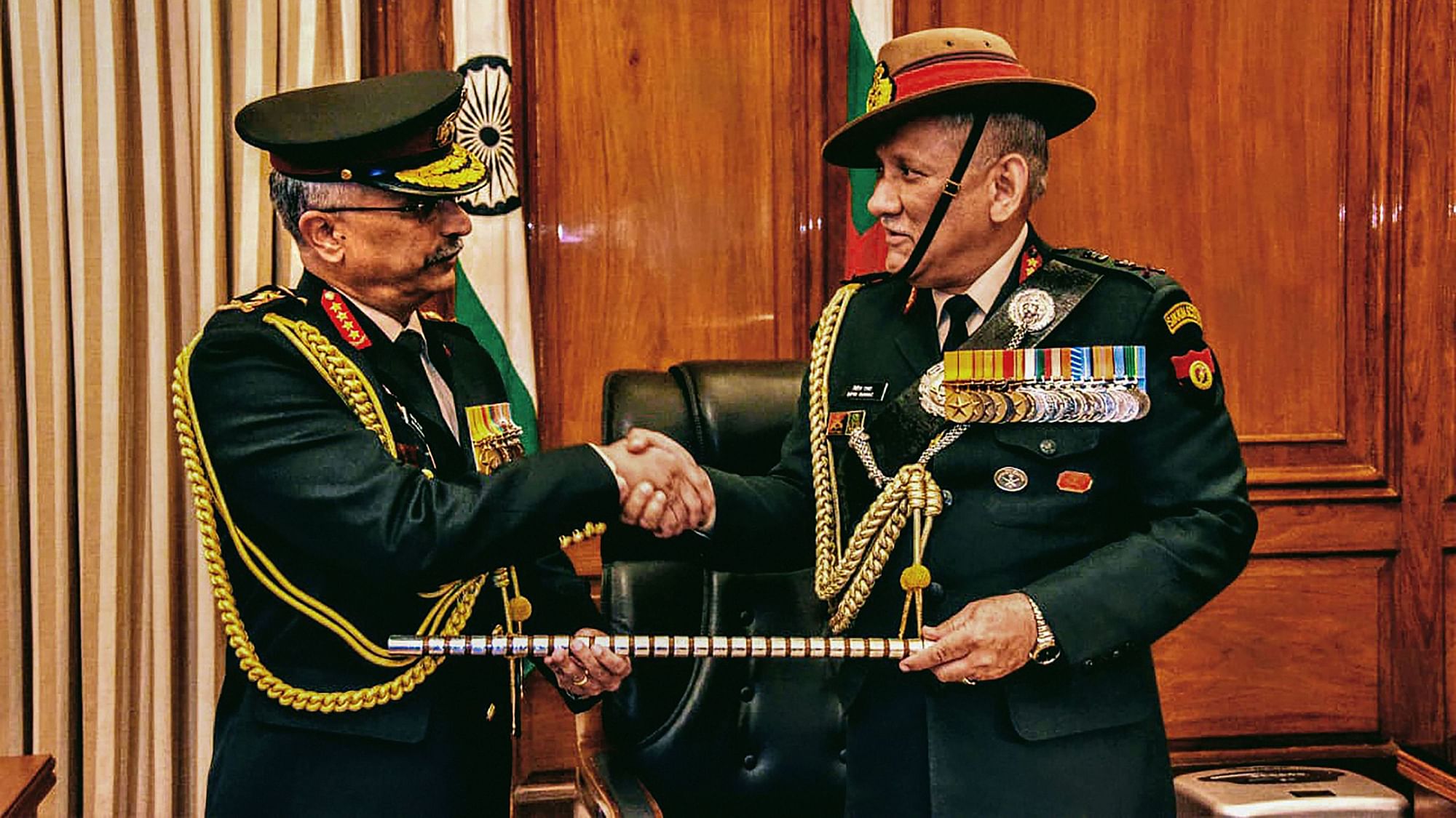 General Manoj Mukund Naravane shakes hands with Chief of Defence Staff Gen Bipin Rawat as the former takes charge as Chief of Army Staff 