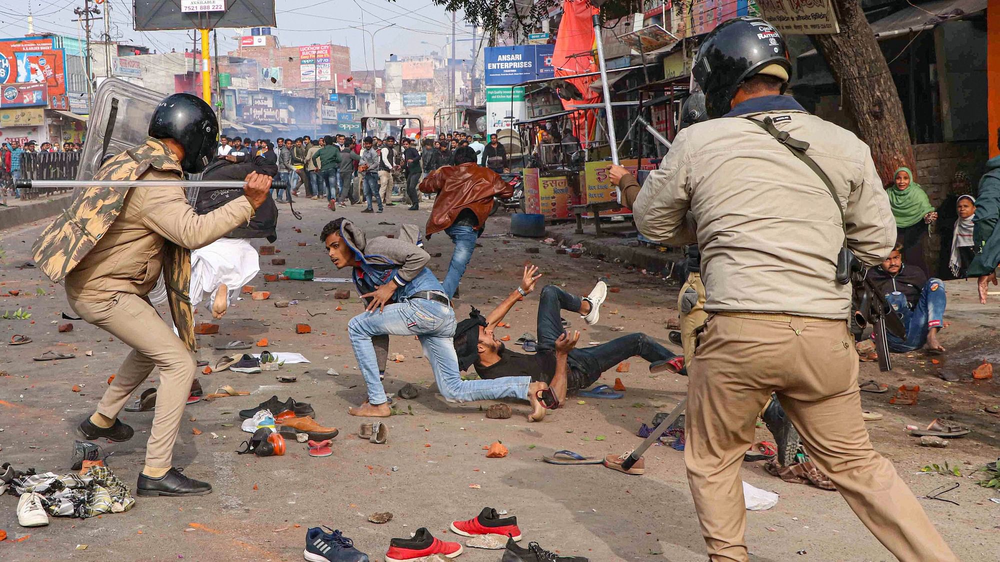 Police personnel baton charge at protesters during their rally against NRC and amended Citizenship Act that turned violent, in Lucknow, on Thursday, 19 December, 2019.
