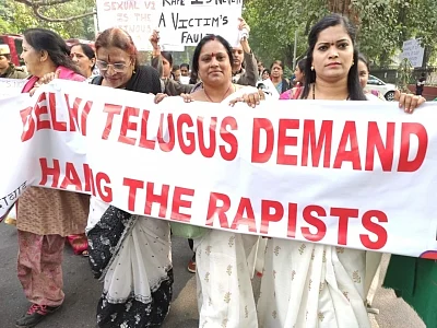 Members of the local Telugu community participate in a pre-scheduled protest march demanding death for the accused in the rape and murder of a young veterinarian in Hyderabad; at the Andhra Bhavan in New Delhi last week. But the apparent execution in an ‘encounter’ in the early hours of Friday, has not dampened their resolve to continue the fight against rape.