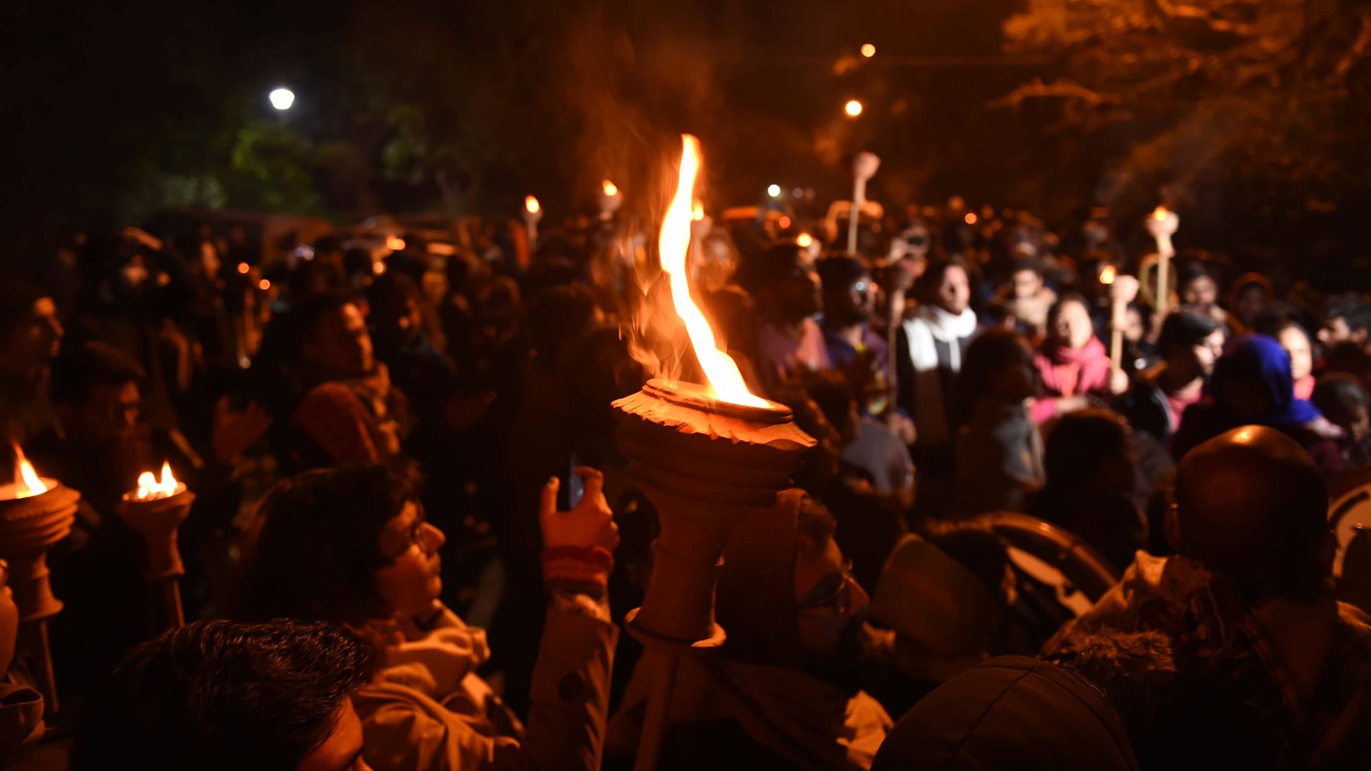 JNU students take part in a Mashal Juloos (torch light procession) to protest against the proposed fee hike on Tuesday.