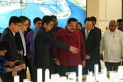 COLOMBO, Dec. 7, 2019 (Xinhua) -- Sri Lankan Prime Minister Mahinda Rajapaksa (3rd R, Front) visits the Colombo Port City along with Chinese Ambassador to Sri Lanka Cheng Xueyuan (2nd R, Front) in Colombo, Sri Lanka, Dec. 7, 2019. Sri Lankan Prime Minister Mahinda Rajapaksa said on Saturday that his government will firmly support and accelerate the development of the Colombo Port City project constructed by China to ensure that it will emerge as a new business hub in the island country. (Xinhua/