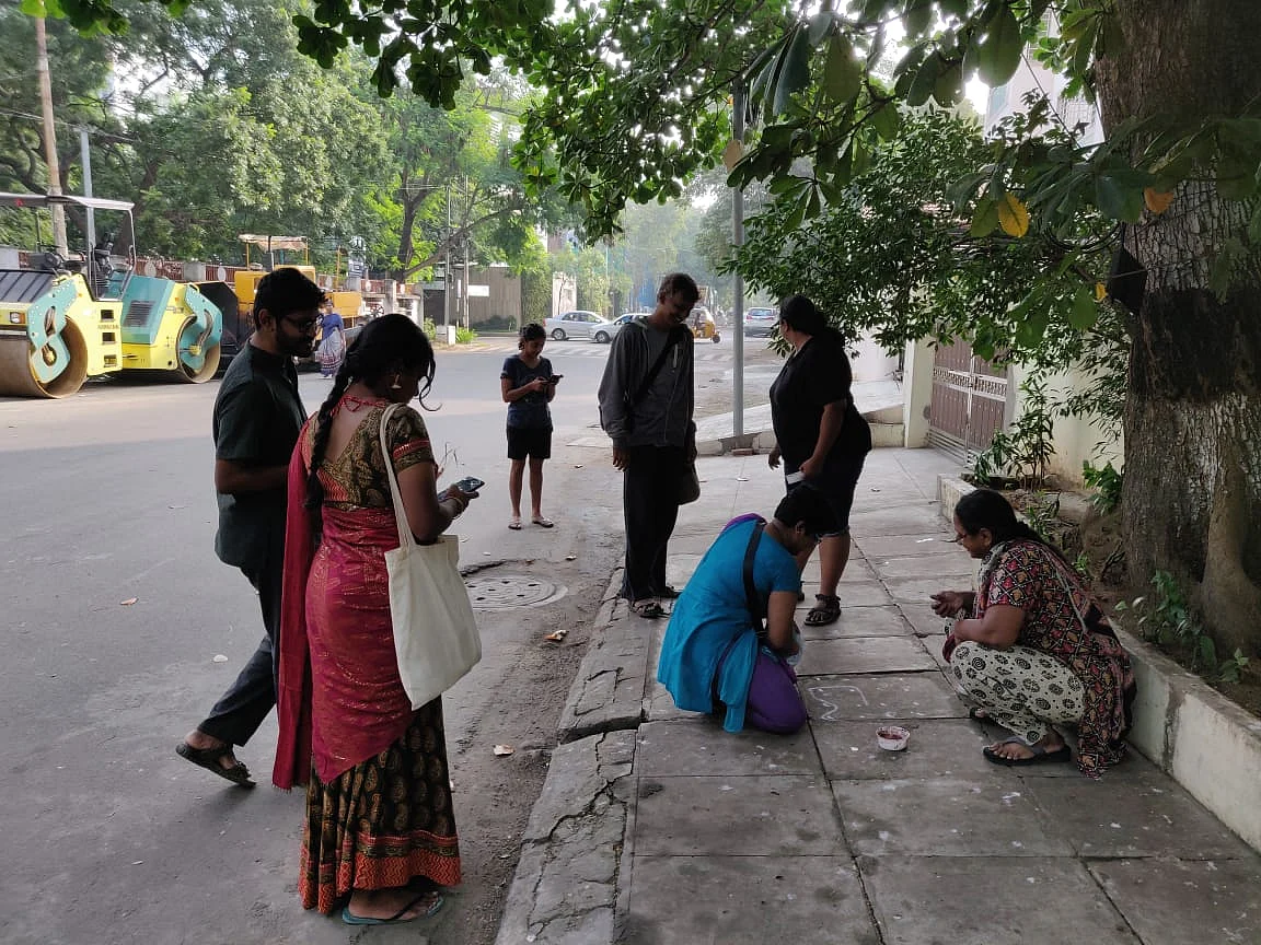 Protesters drawing kolams <em>(rangoli) </em>outside people’s houses with anti-CAA slogans, shot on Sunday, 29 December.