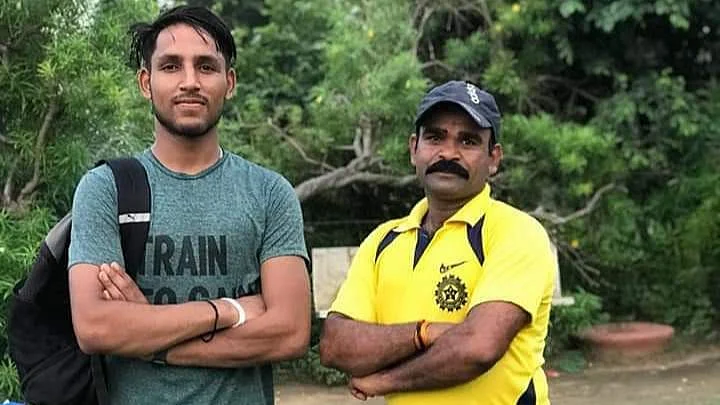 Dhruv Chand Jurel (left) with his coach.