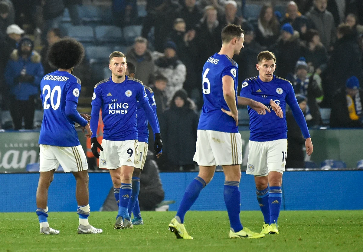 Leicester players walk on the pitch in dejection at the end of the English Premier League soccer match between Leicester City and Liverpool at the King Power Stadium in Leicester, England, Thursday, Dec. 26, 2019. 