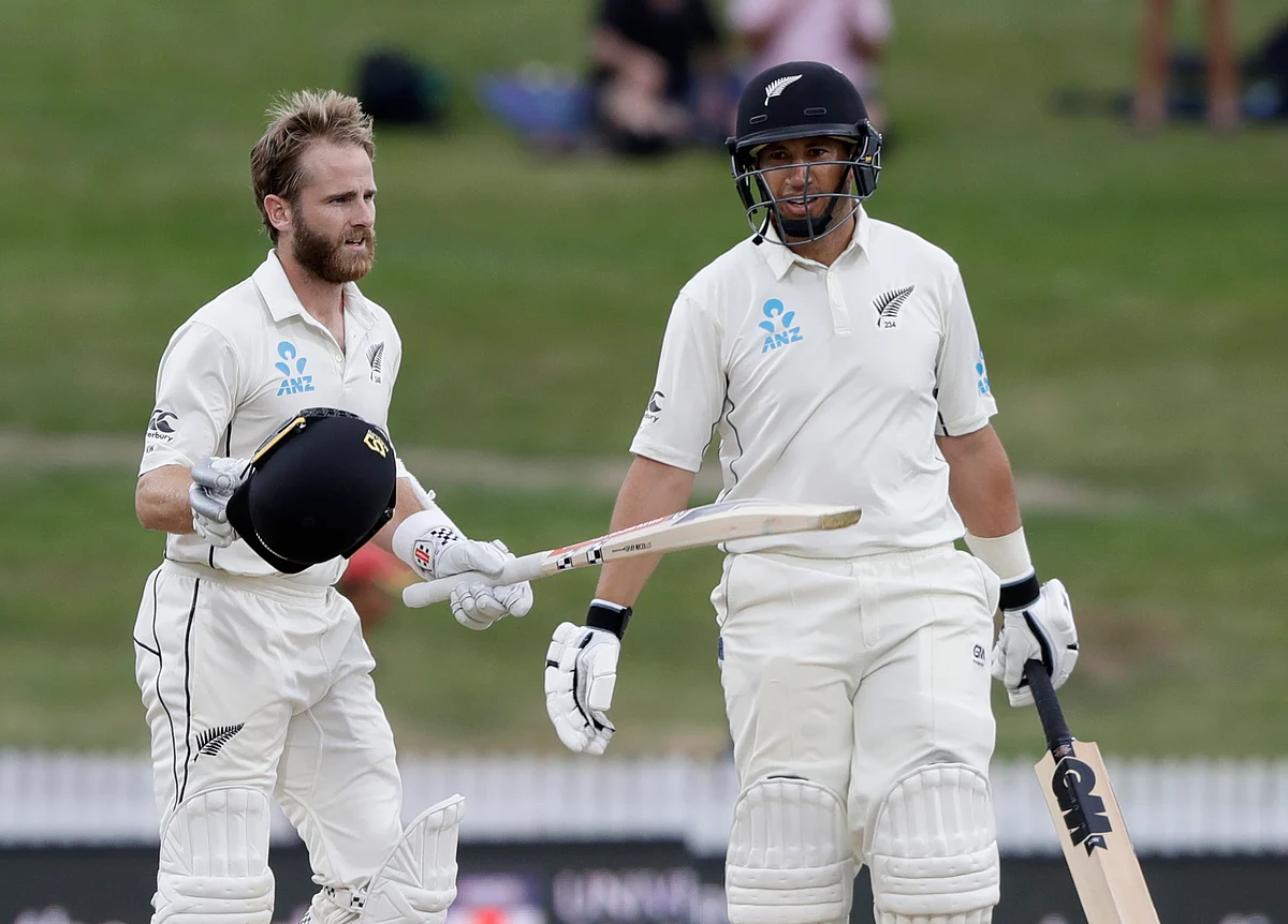 New Zealand’s Kane Williamson, left, reacts after scoring a century as teammate Ross Taylor looks on during play on the final day of the second cricket Test.