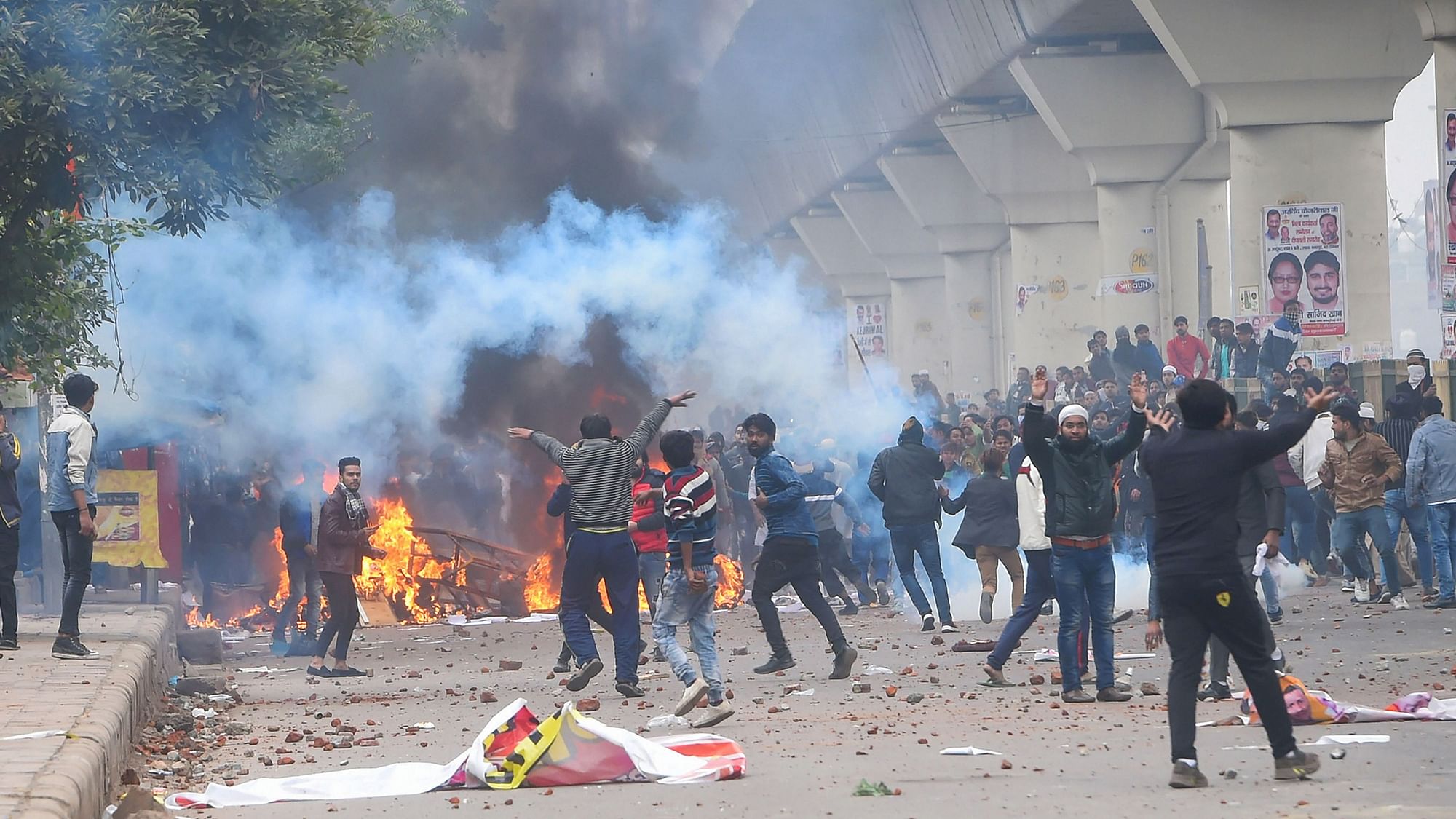 Brickbats lie on a road as anti-CAA protestors clash with the police at Seelampur in New Delhi on 17 December.&nbsp;