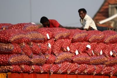 Chennai: Onions arrive at a wholesale market in Chennai on Dec 6, 2019. Onion prices have touched an all-time high with the vegetable being sold at Rs 140 a Kg in Chennai. (Photo: IANS)