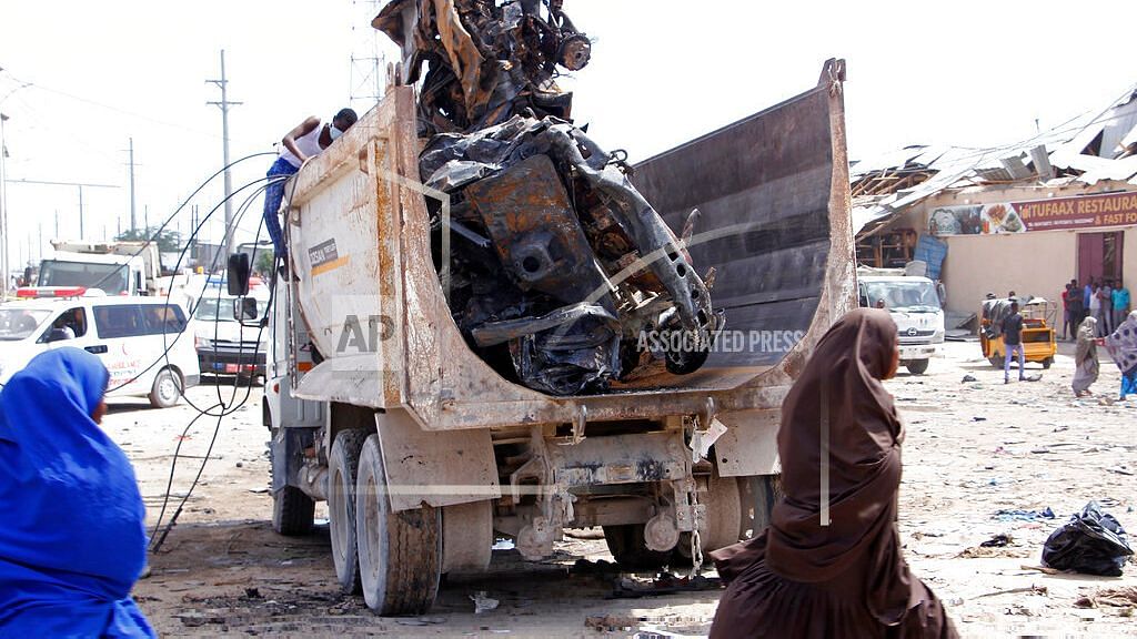 A truck carries wreckage of a car used in a car bomb in Mogadishu, Somalia, on Saturday, 28 December. A truck bomb exploded at a busy security checkpoint in Somalia’s capital Saturday morning, authorities said. It was one of the deadliest attacks in Mogadishu in recent memory.