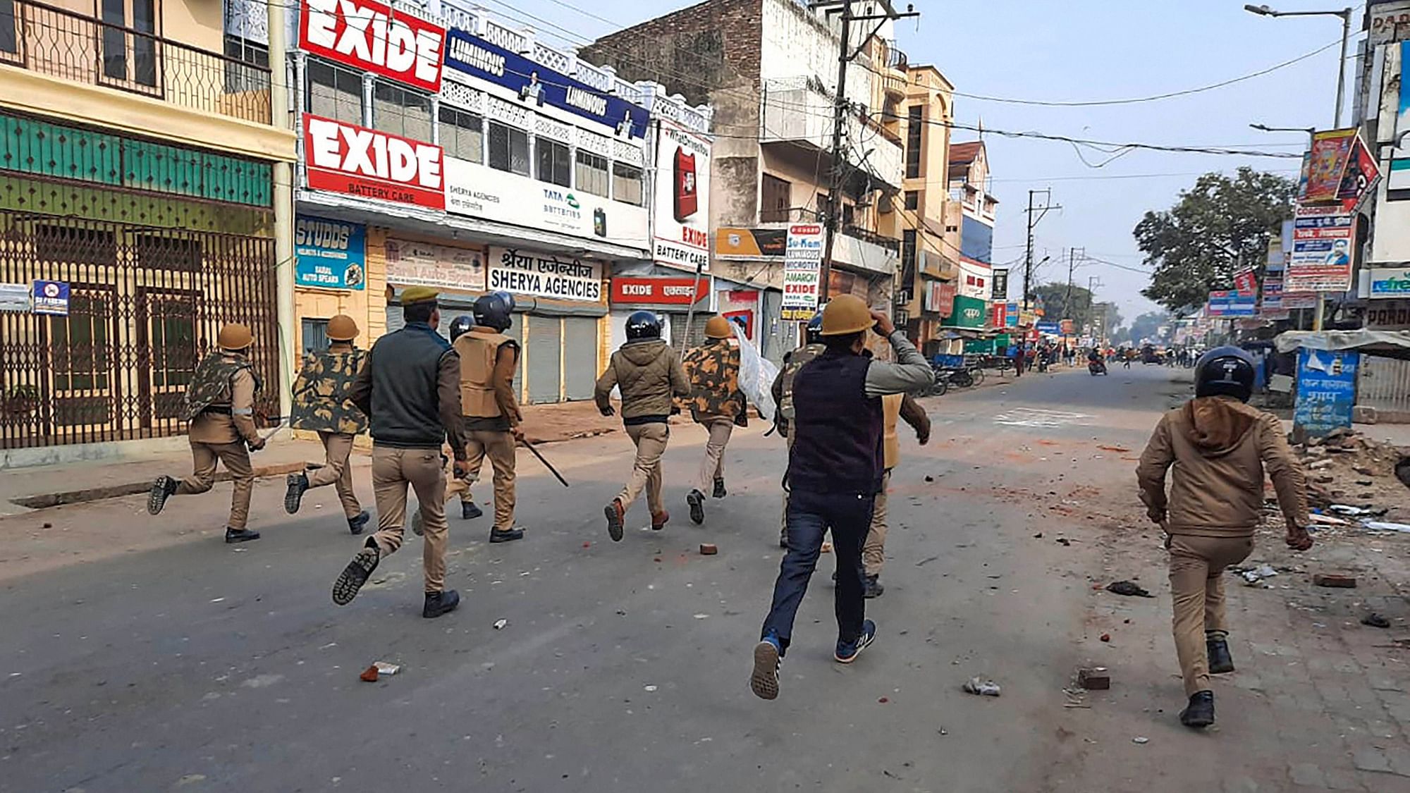 Police personnel clash with protesters during a rally against the Citizenship Amendment Act (CAA), in Bahraich district of Uttar Pradesh, on Friday, 20 December.