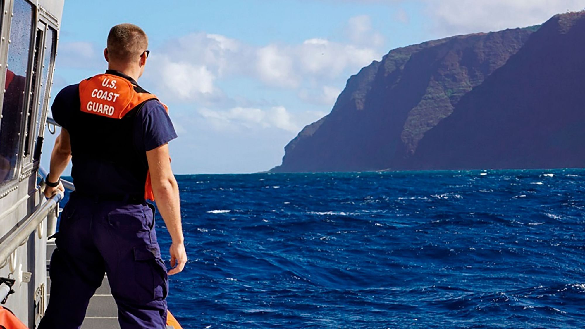 In this photo released by the U.S. Coast Guard, Coast Guard Cutter William Hart moves toward the Na Pali Coast on the Hawaiian island of Kauai.