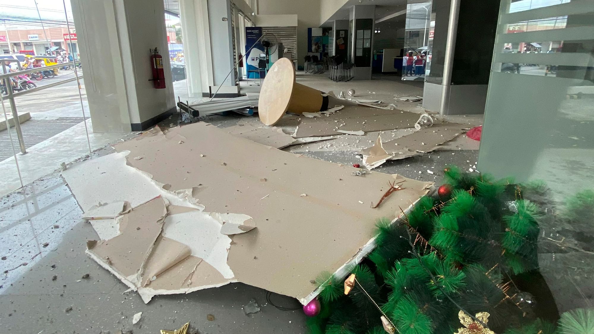 In this photo provided by the Philippine Red Cross, a Christmas tree and other debris lie on the ground inside a building after a strong earthquake shook Digos, Davao del Sur province, southern Philippines on Sunday.