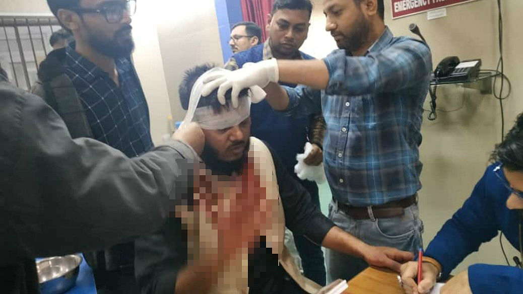 At least two dozen protesters and police personnel were injured in clashes that broke out at Delhi’s Jamia Millia Islamia University.