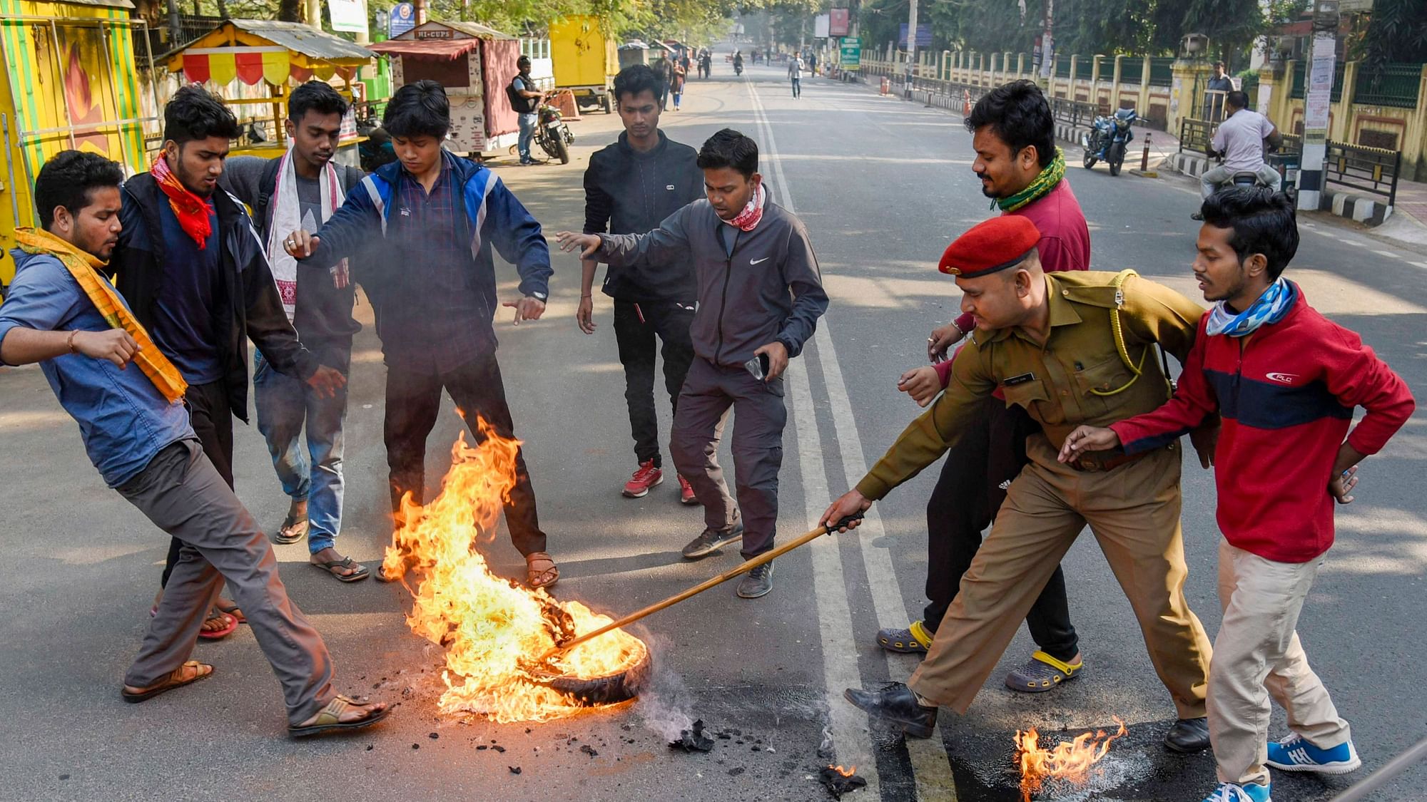 Demonstrators burn tyres during a strike  in protest against the Citizenship Amendment Bill in Guwahati, Assam.