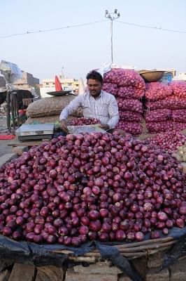 Amritsar: A vendor arranges onions at a wholesale market in Amritsar, on Dec 4, 2019. Onion prices across the country continue to soar. (Photo: IANS)