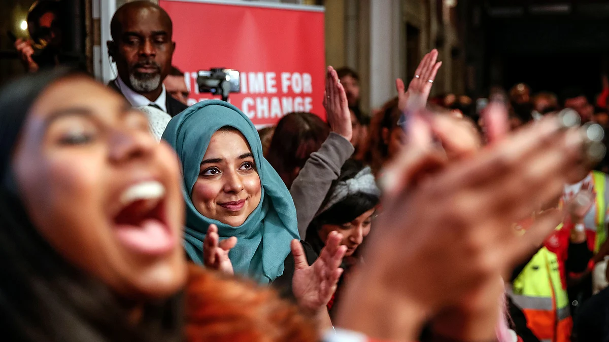 Supporters cheer as Labour Leader Jeremy Corbyn addresses on eve of poll rally in London. 