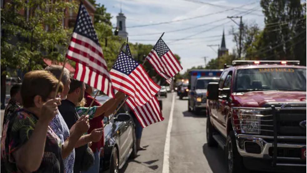  A memorial procession for Sergeant James Johnston, who was killed in Afghanistan in June, passes through Trumansburg on 31 August 2019.