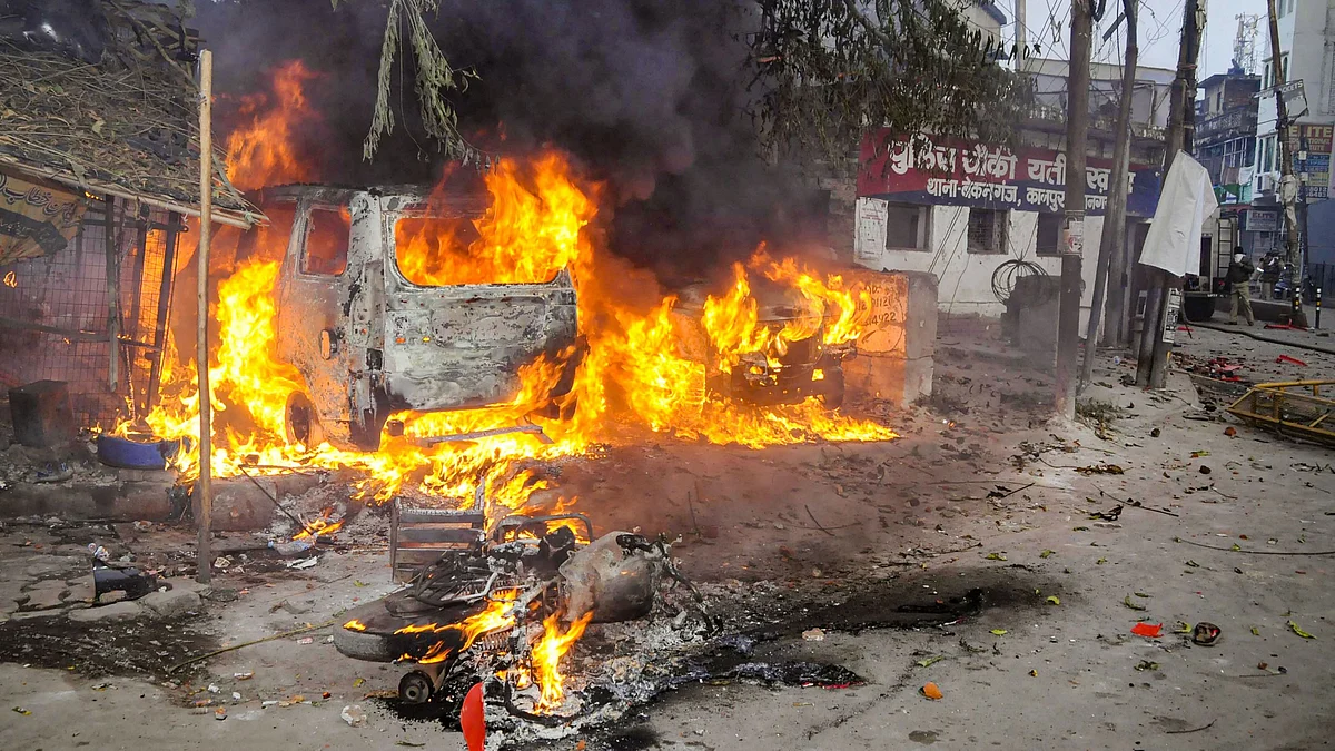A vehicle torched allegedly by protestors in Kanpur