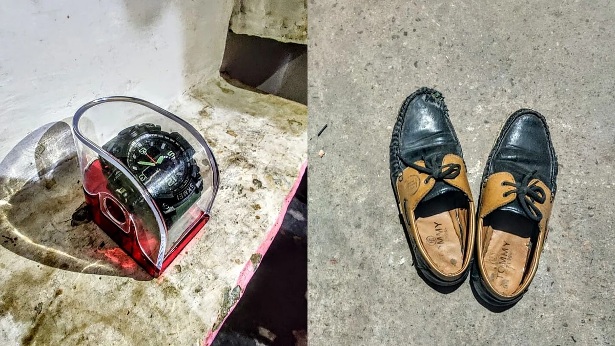 On the left is Suleiman’s watch bought by his aunt and never worn by him, and on the right is Anas’ shoes. Their belongings remain untouched now.