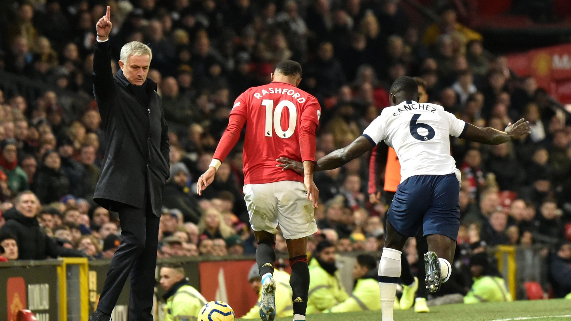 Tottenham’s manager Jose Mourinho, left, reacts as Manchester United’s Marcus Rashford, centre, and Tottenham’s Davinson Sanchez challenge for the ball during the English Premier League match.