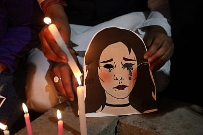 New Delhi: Youth Congress activists participate in a candlelight vigil to protest against the death of Unnao rape victim, highlighting the rise in incidents of crimes against women, in New Delhi on Dec 7, 2019. (Photo: IANS)