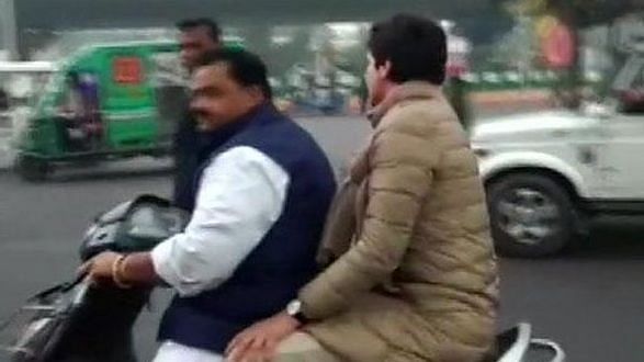 Congress General Secretary Priyanka Gandhi Vadra being driven on a scooty by party leader Dheeraj Gurjar after the police tried to block her way to SR Darapuri’s residence in Lucknow on 28 December.