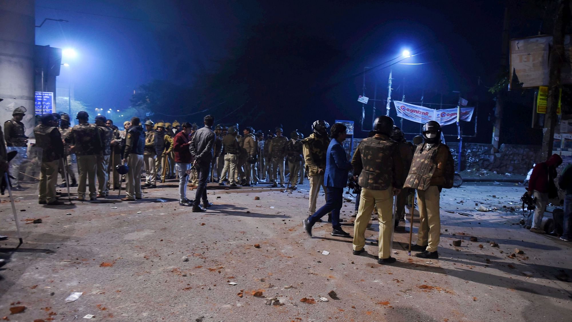 Policemen stand guard near Jamia Millia Islamia.&nbsp;