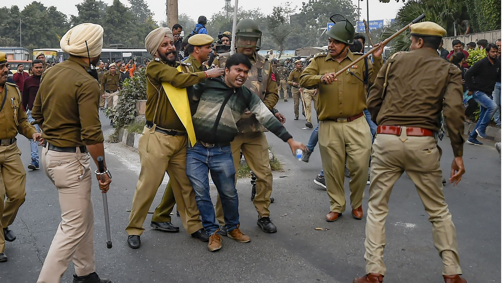 JNU students engaged in a scuffle with the police during their march from the university campus to Rashtrapati Bhavan on Monday, 9 December.