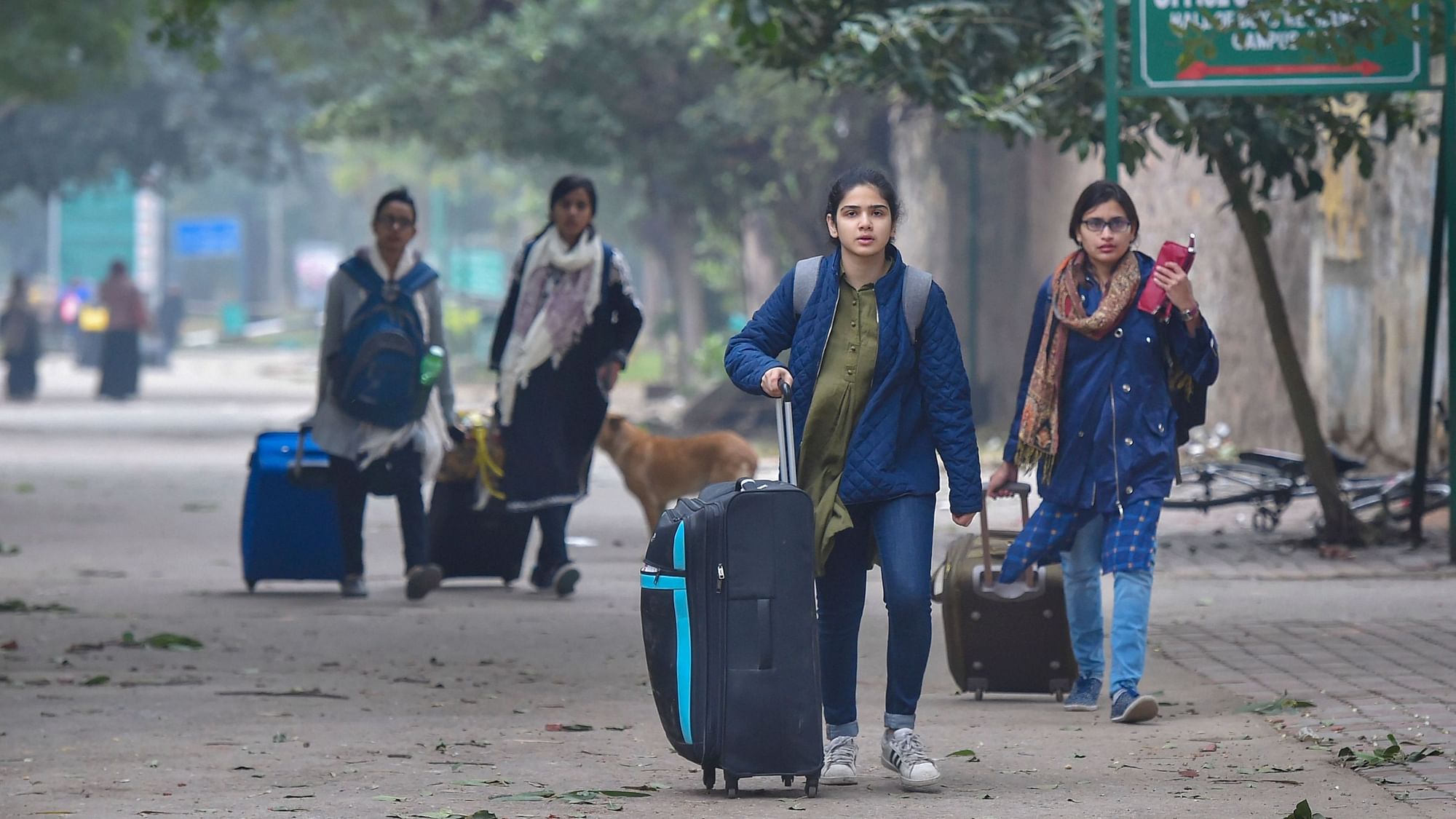 Students leave from Jamia Millia Islamia.  The university is closed till  5 Jan following the protests against Citizenship Amendment Act.