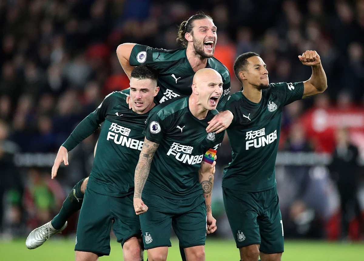 Newcastle United’s Jonjo Shelvey, centre below, celebrates with teammates after scoring his side’s second goal of the game against Sheffield United, during their English Premier League soccer match at Bramall Lane in Sheffield, England.