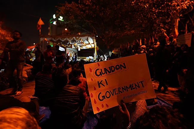 Protesters holding placards condemning the attack on JNU students.