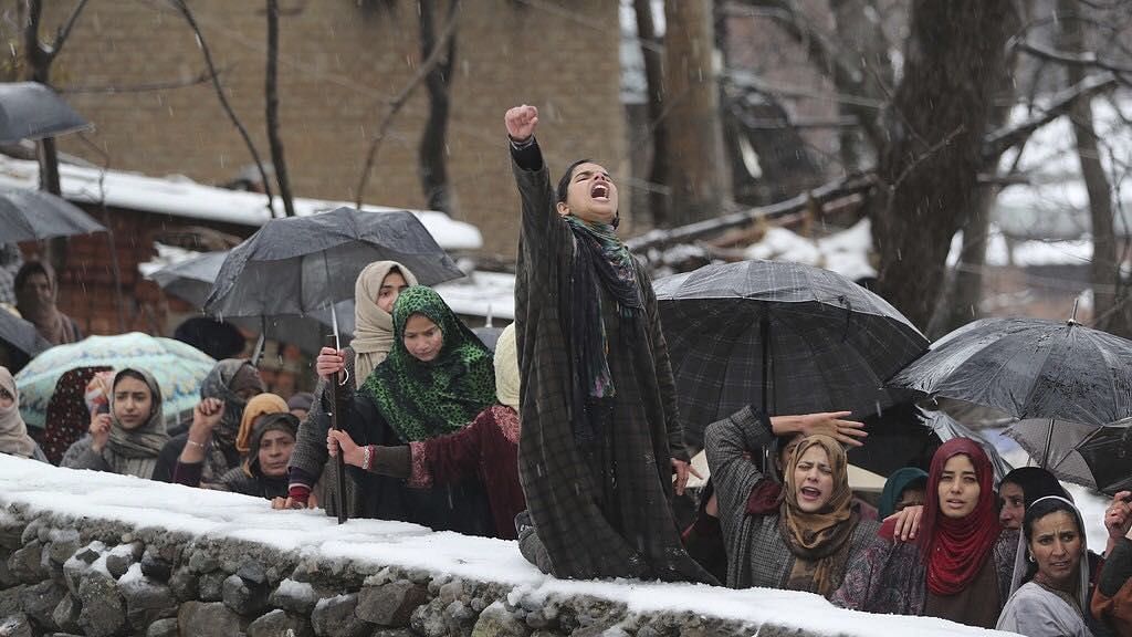 Kashmiri women shout slogans during the funeral of top Hizbul commander Umar Fayaz in village Tral, south of Srinagar, UT of J&K, Monday,  13 January 2020. 