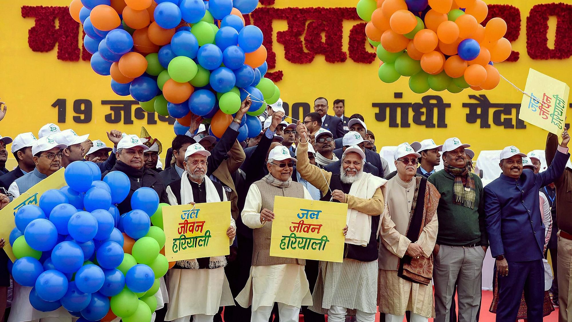 Bihar Chief Minister Nitish Kumar (4th L) along with deputy CM Sushil Kumar Modi (3rd L), Jal Purush Rajendra Singh (4th R) and others participates in forming a human chain in support of Jal Jivan Hariyali Movement against climate crisis, prohibition and social ills including dowry and child marriage in Patna on Sunday,19 January 2020.