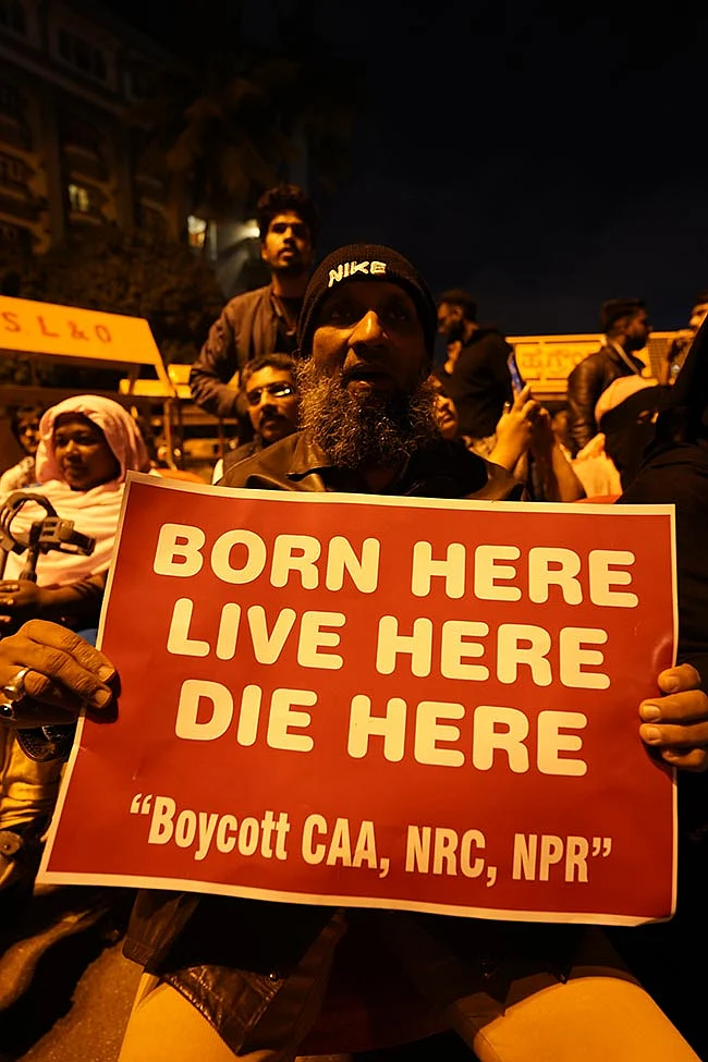 A protester holding placard against the controversial Citizenship Amendment Act (CAA), National Registry of Citizens (NRC) and National Population Register (NPR).