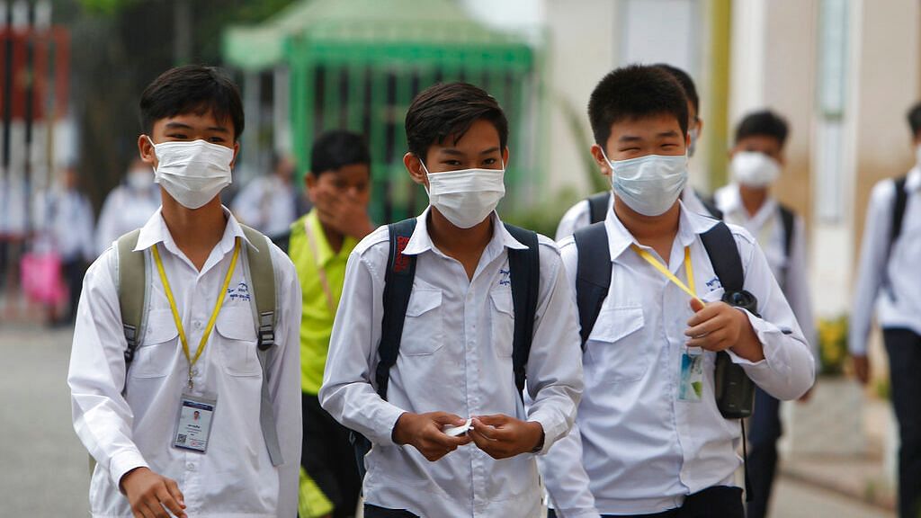 Students wear masks to avoid the contact of coronavirus in China’s Cambodia.