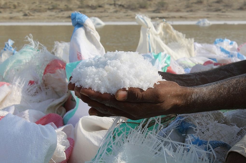 Labourers collecting salt from Achro Thar’s lakes in Pakistan’s  Sindh live in poverty & work in extreme conditions.