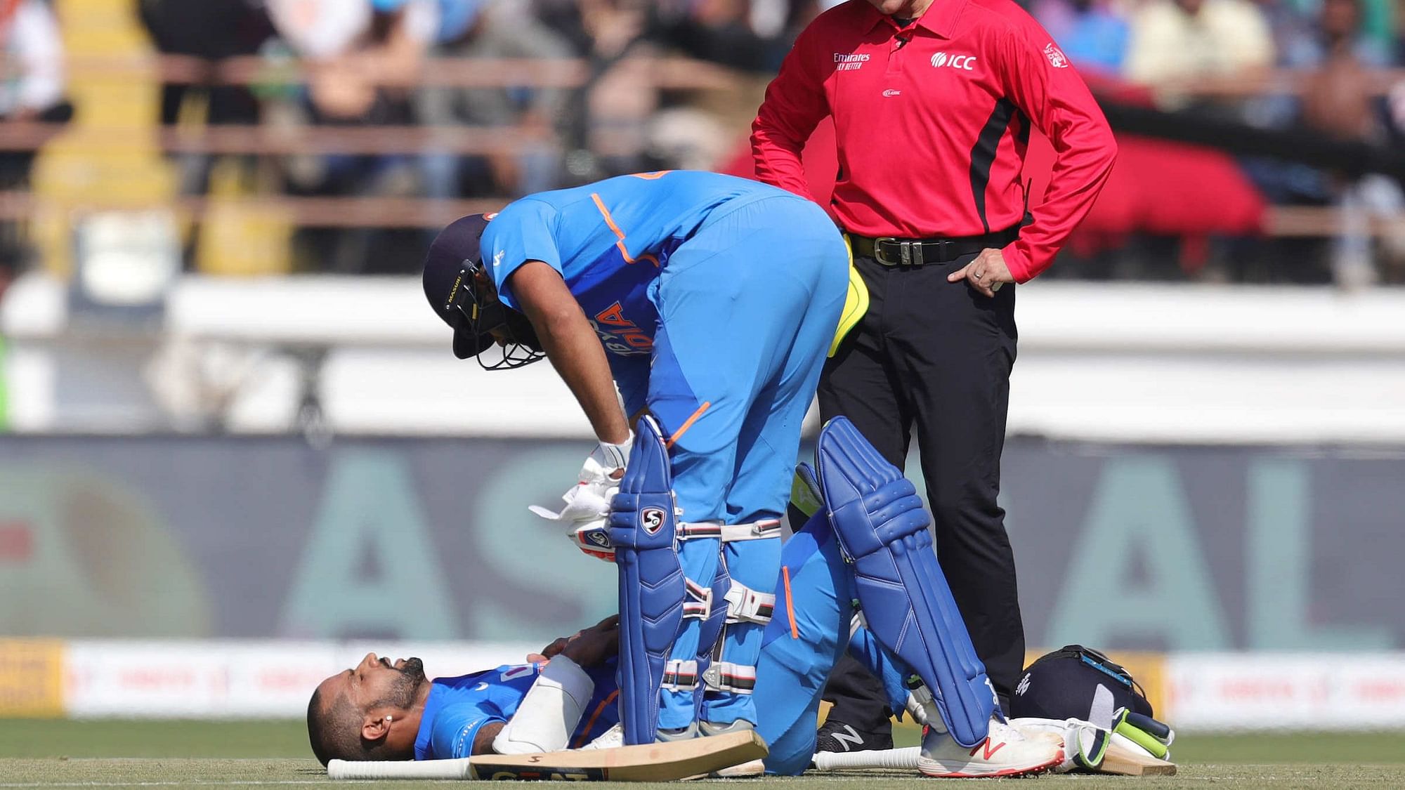 Shikhar Dhawan was hit on the rib cage in the 10th over of the Indian innings in the second ODI in Rajkot on Friday.