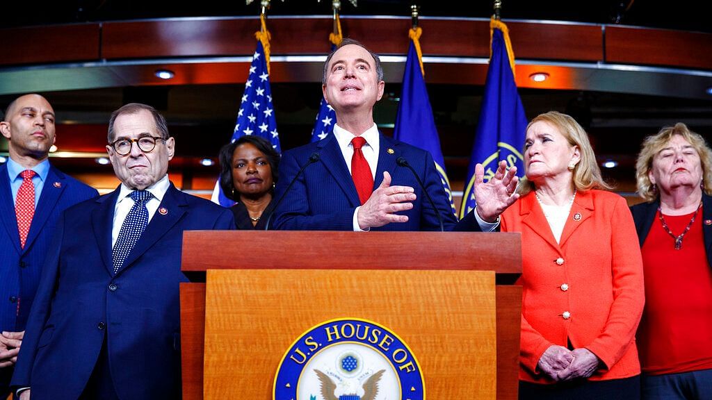 Rep Adam Schiff, D-Calif, center, joined by fellow House Democratic impeachment managers, from left, Rep Hakeem Jeffries, Judiciary Committee Chairman Jerrold Nadler, Rep Val Demings, Schiff, Rep Sylvia Garcia, and Rep Zoe Lofgren, speak during a news conference, on 28 January.