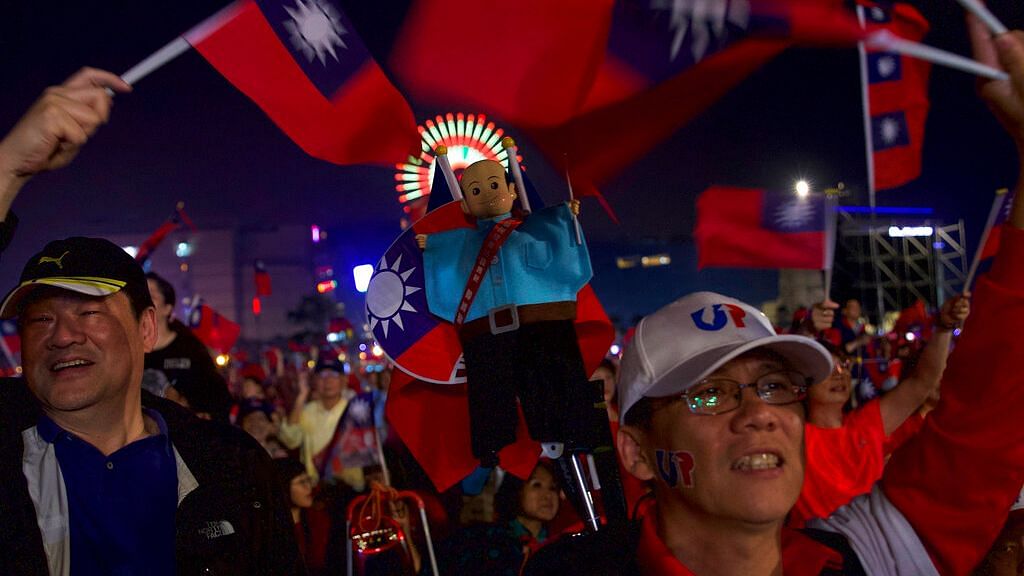A supporter holds a doll in the image of of Han Kuo-yu, Taiwan’s 2020 presidential election candidate of the KMT or Nationalist Party, during a campaign rally in southern Taiwan’s Kaohsiung city on Friday, 10 January. Taiwan will hold its presidential election on 11 January.