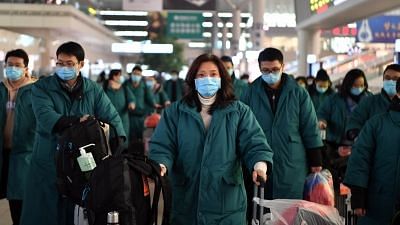 Members of a medical team prepare to board a train at Zhengzhou East railway station in Zhengzhou, central China.