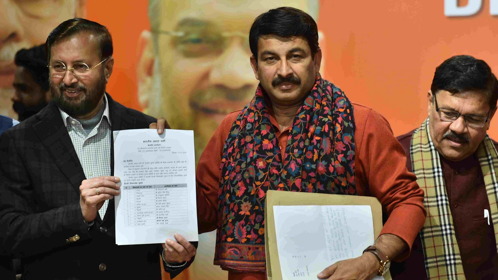 Delhi BJP Chief Manoj Tiwari with Union Minister Prakash Javadekar and BJP Vice-President Shyam Jaju during the release of BJP’s first list of 57 candidates for Delhi Assembly polls.