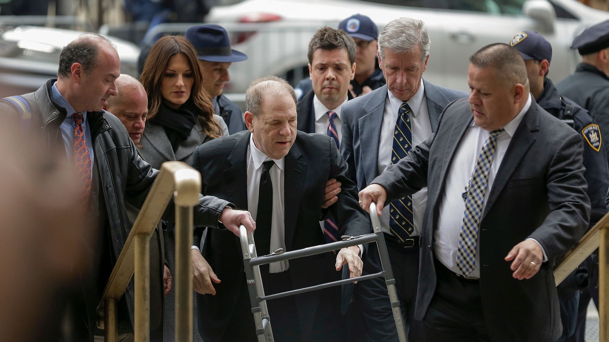 Harvey Weinstein surrounded by court officers as he leaves court following a pre trial hearing.