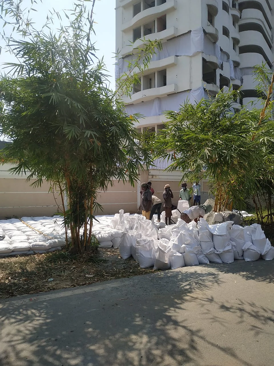 Workers fill sandbags that are to be placed over oil pipelines in the area. 